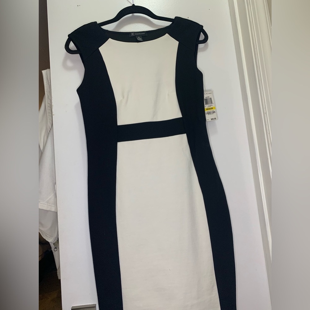 Amp your style with this crisp sheath silhouette dress